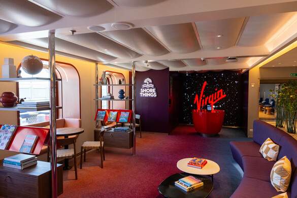 Virgin Voyages Valiant Lady shore things desk.JPG